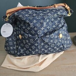 Authentic: Louis Vuitton Gm Daily denim Monogram shoulder bag.